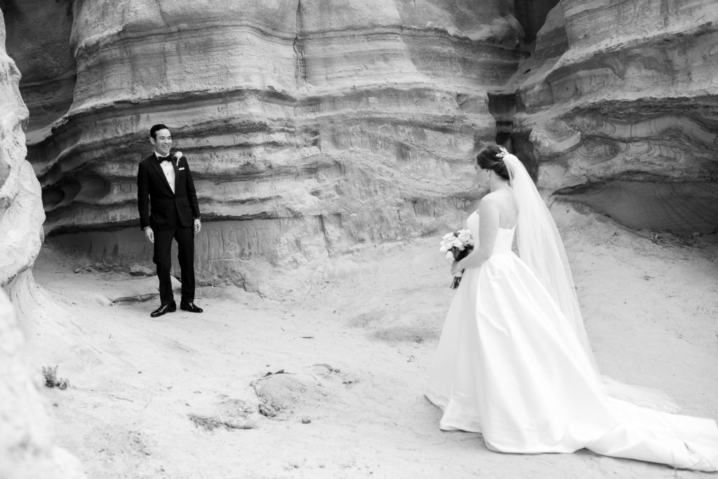 San Clemente beach bride and groom first look black and white