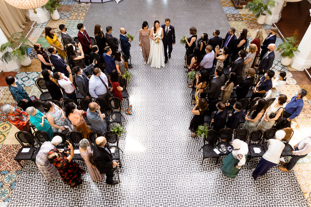 Ebell of Long Beach wedding photos - overhead shot of bride walking down the aisle