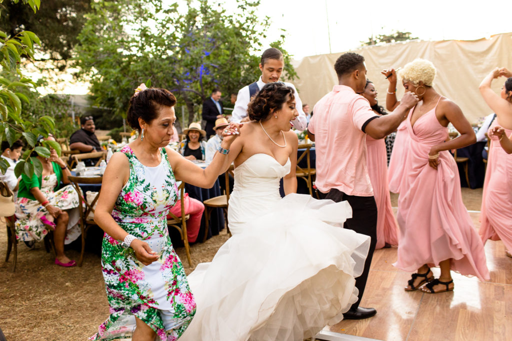 bride and mom dancing at reception