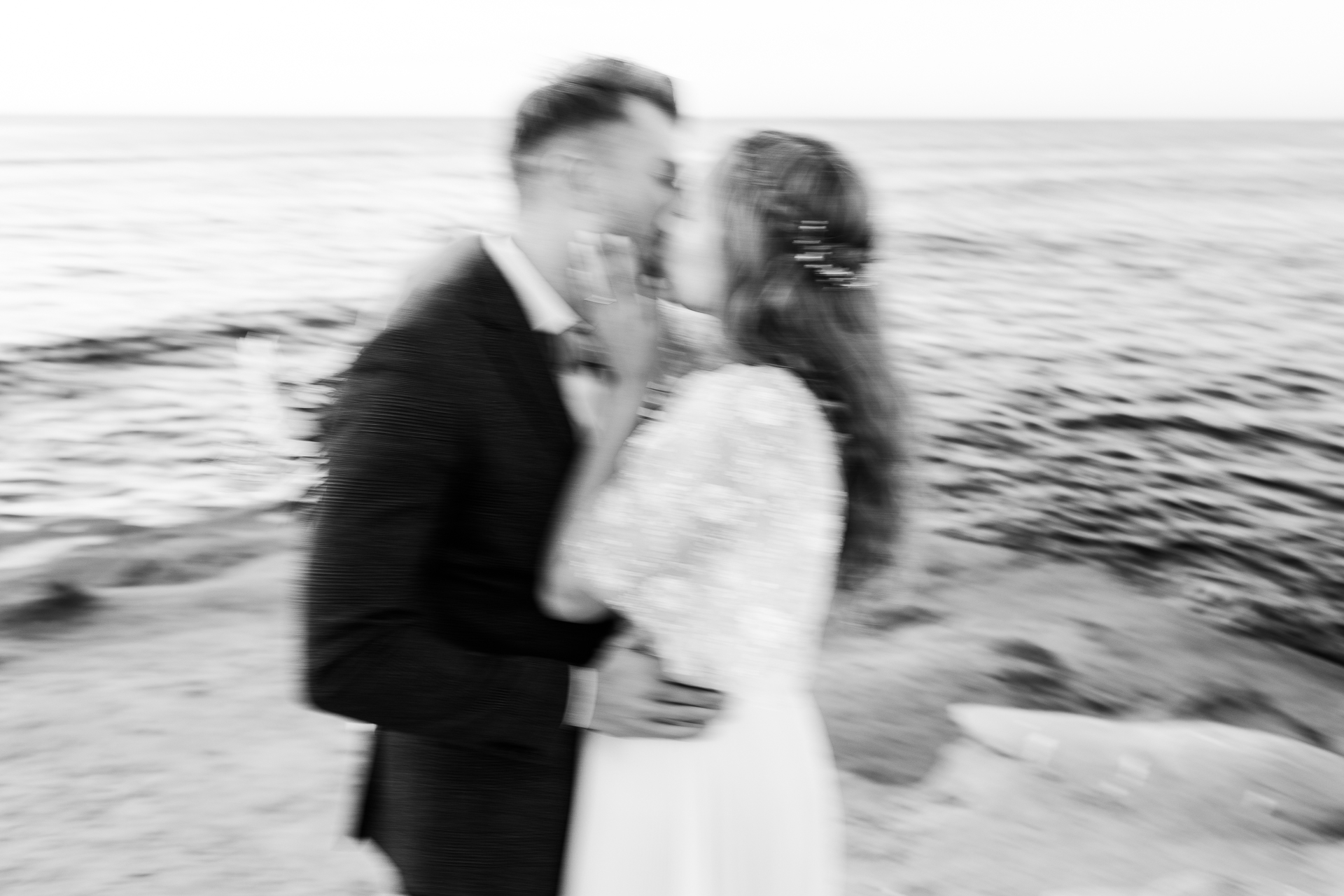 sunset cliffs, san diego wedding bride and groom portraits black and white blurry