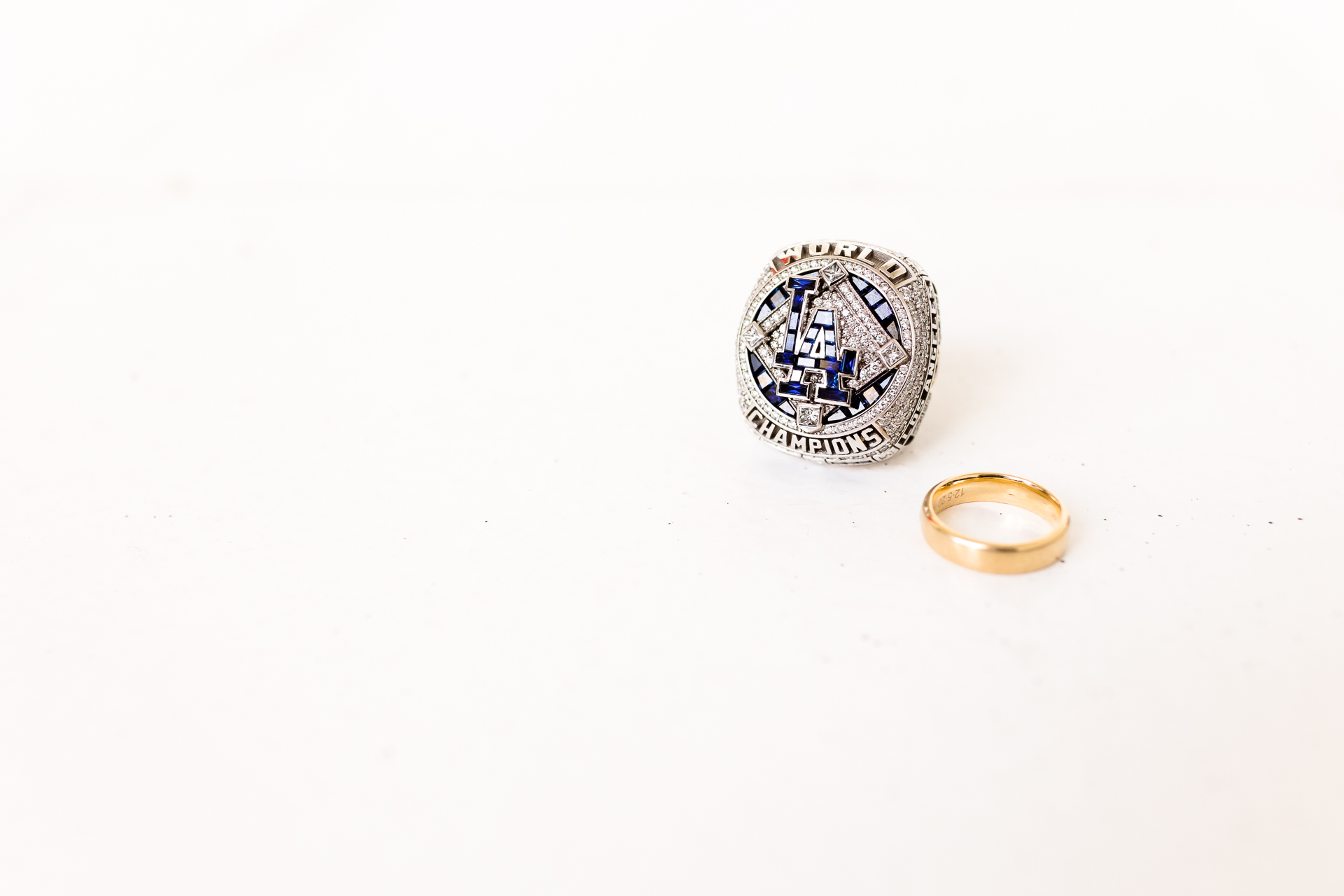 groom's wedding ring with LA Dodgers world series ring