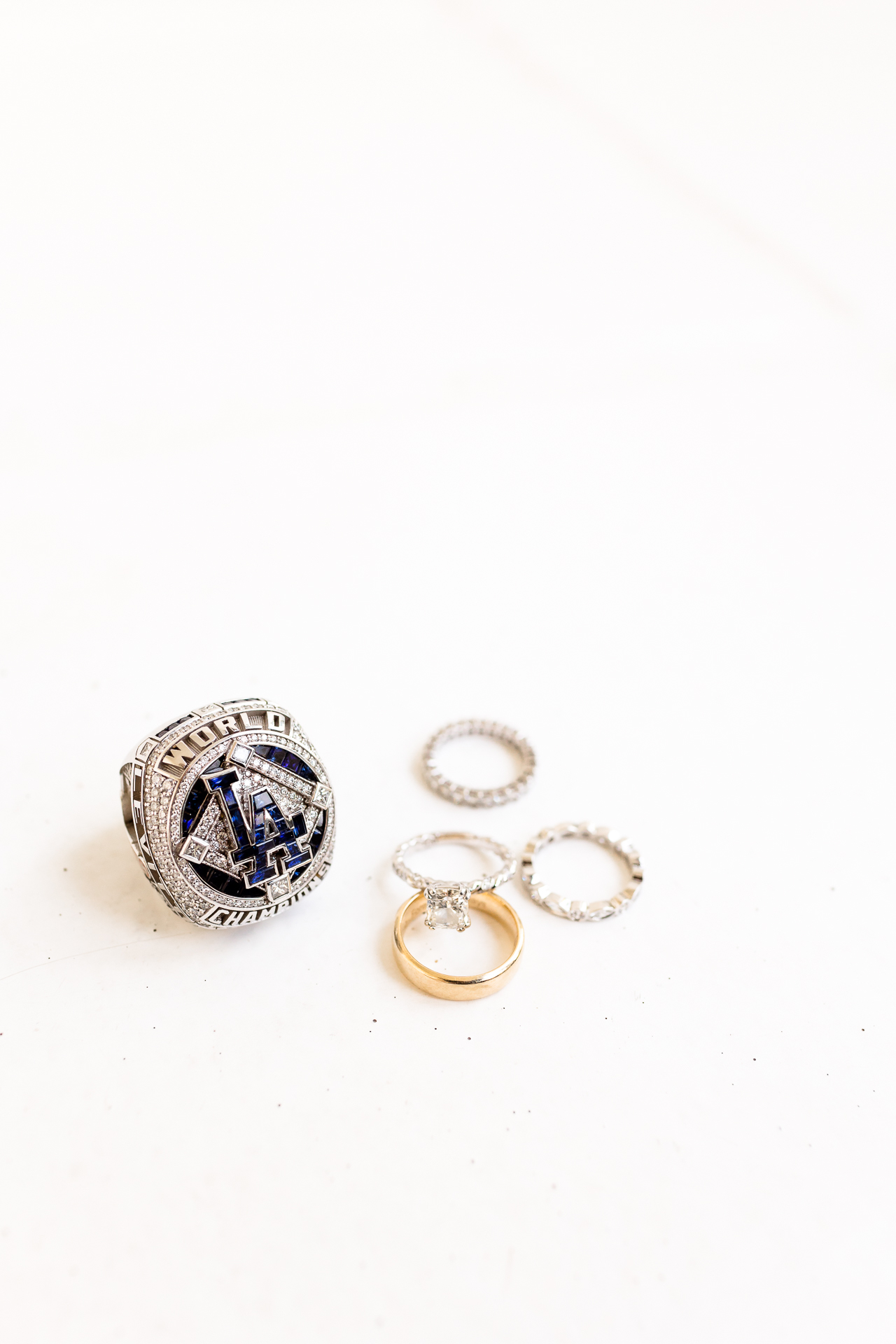 bride and groom wedding rings with LA Dodgers world series ring