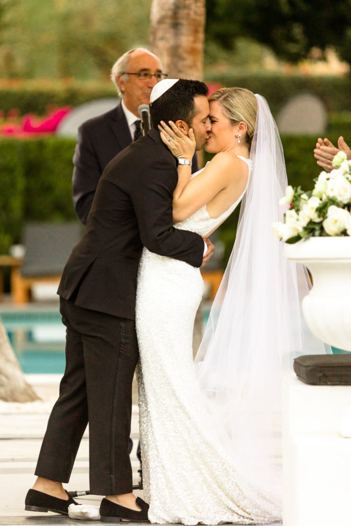 bride and groom first kiss, Avalon Hotel wedding, Palm Springs California