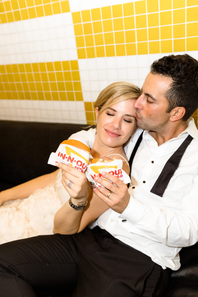bride and groom eating In N Out Avalon Hotel wedding, Palm Springs California