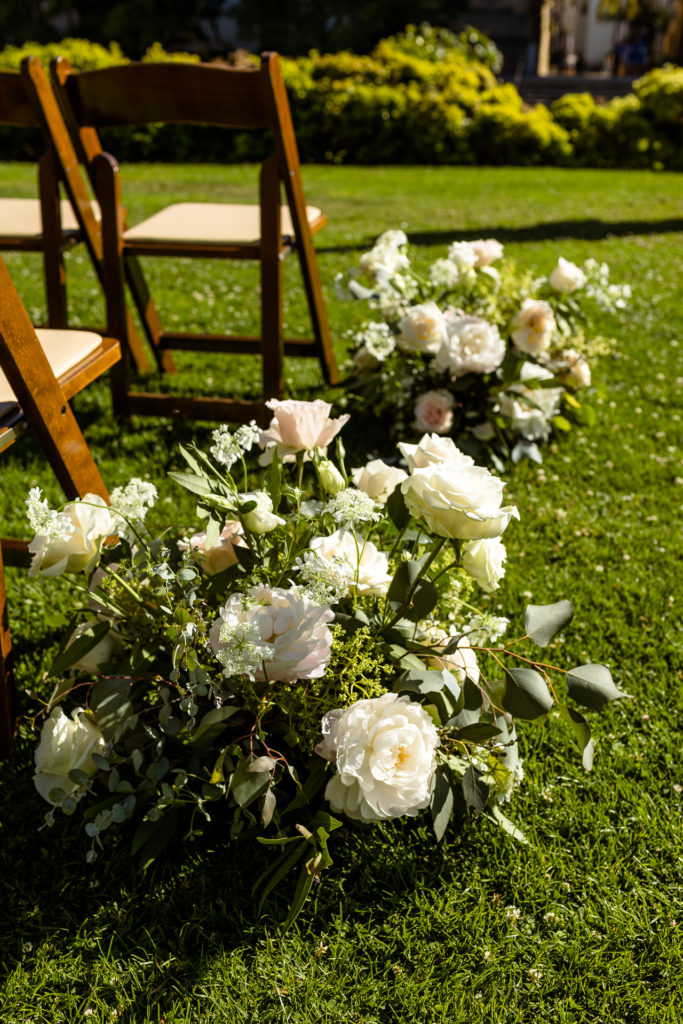 santa barbara courthouse wedding flowers down the aisle