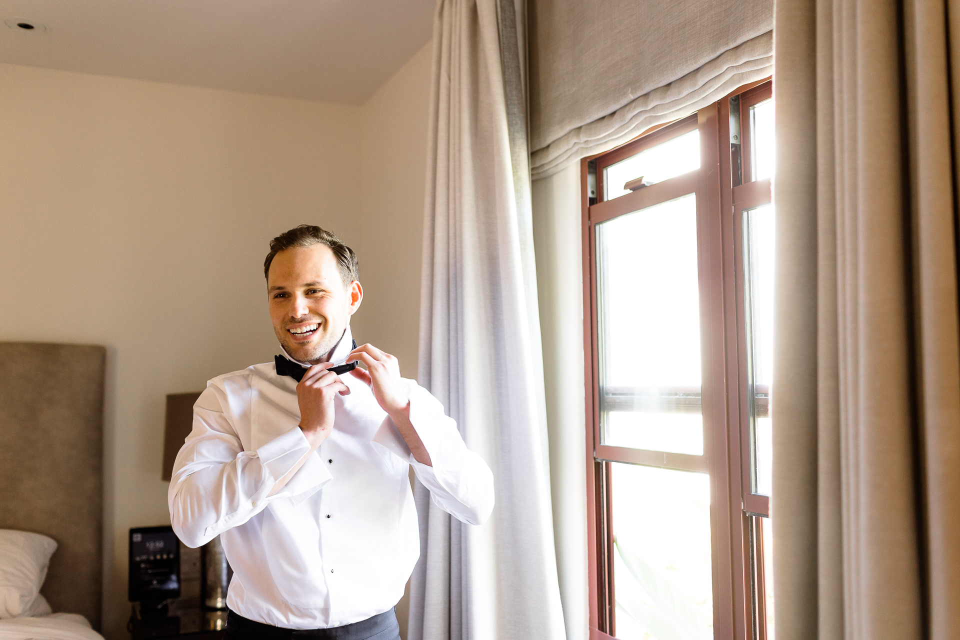 groom getting ready hotel room ojai valley inn