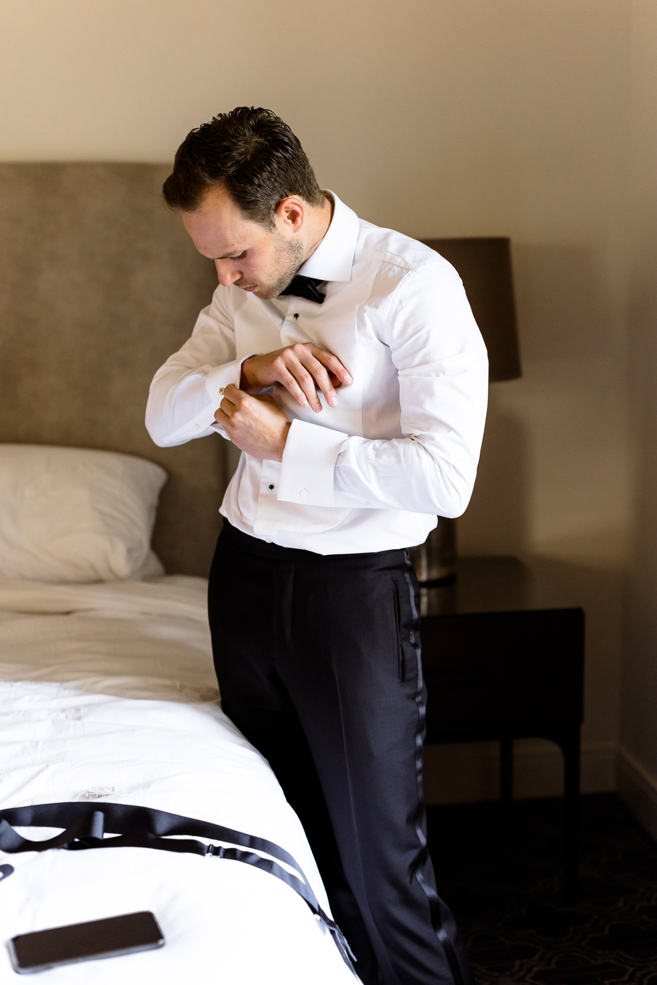 groom getting ready hotel room ojai valley inn