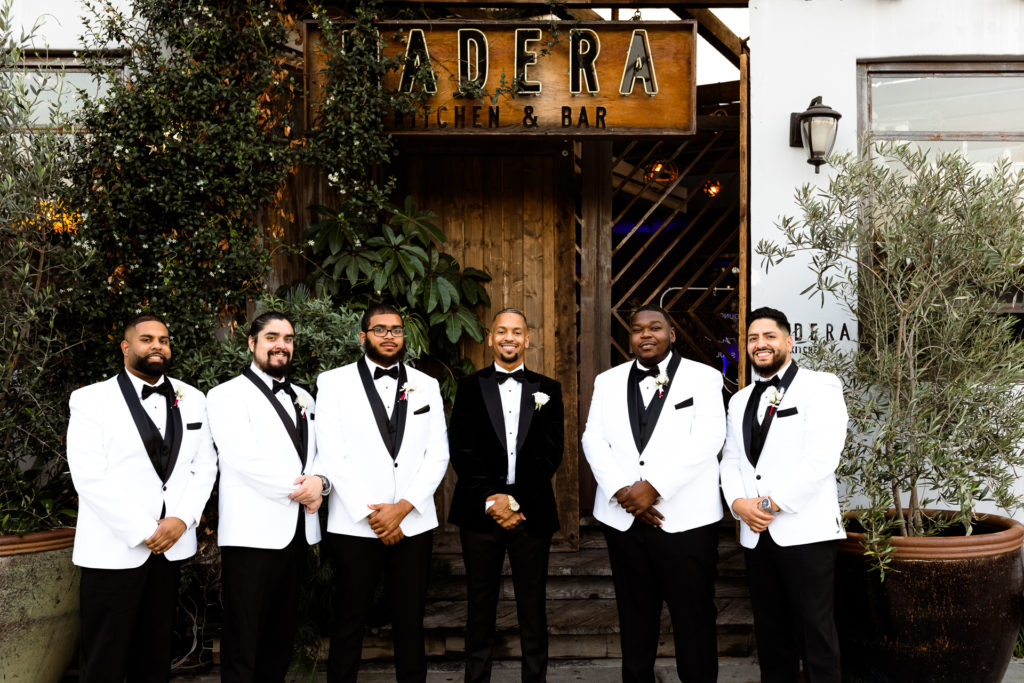 groomsmen in front of madera kitchen wedding venue