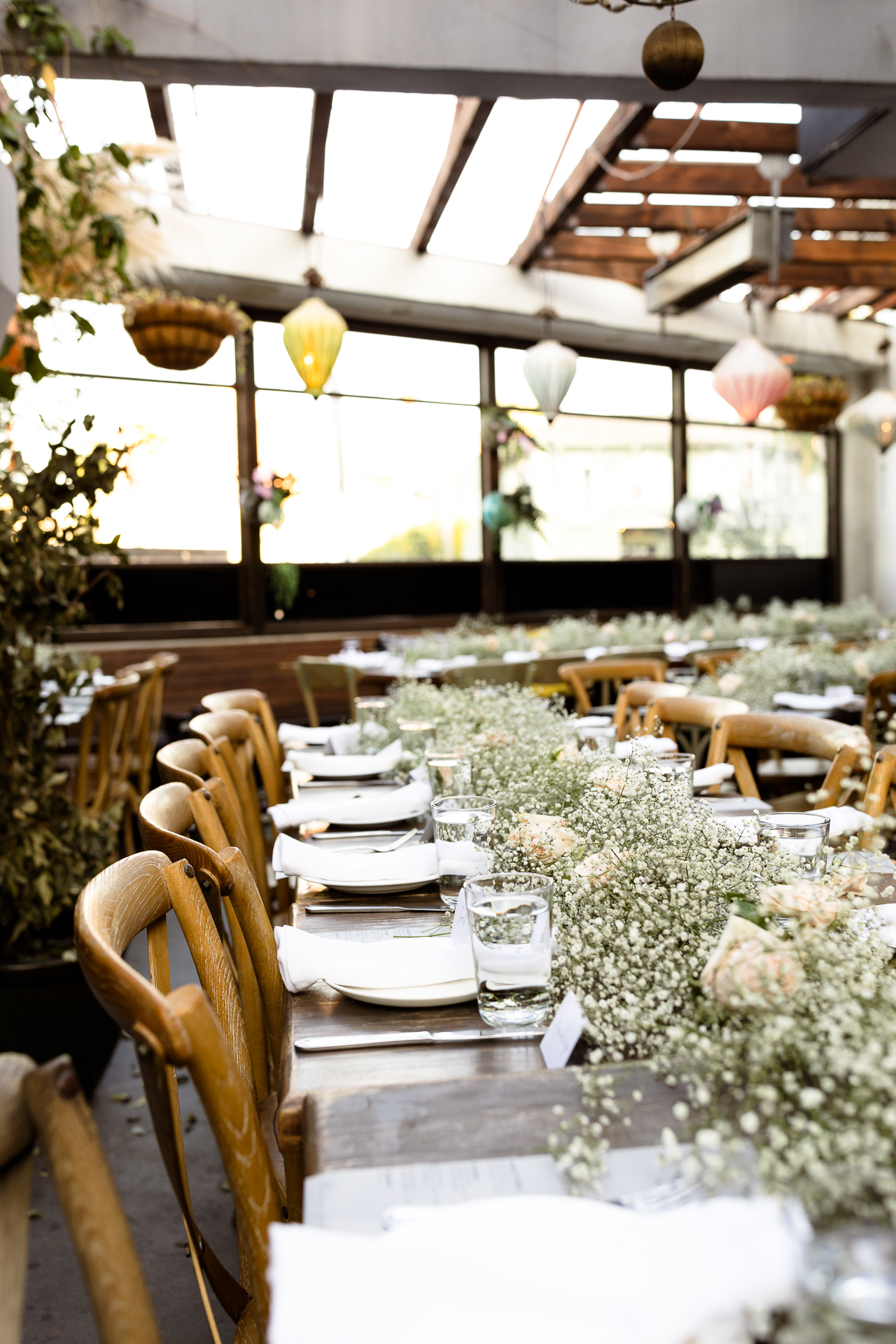 baby's breath on tables at madera kitchen wedding venue