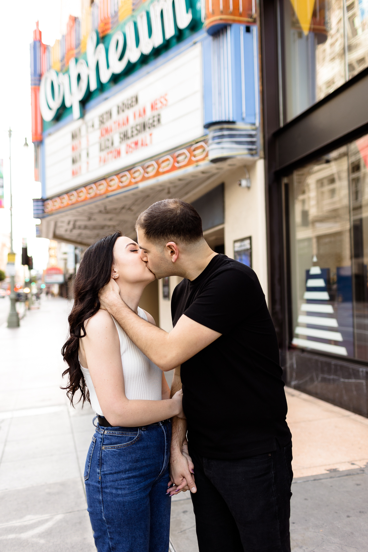 couple kissing in front of the orpheus downtown los angeles